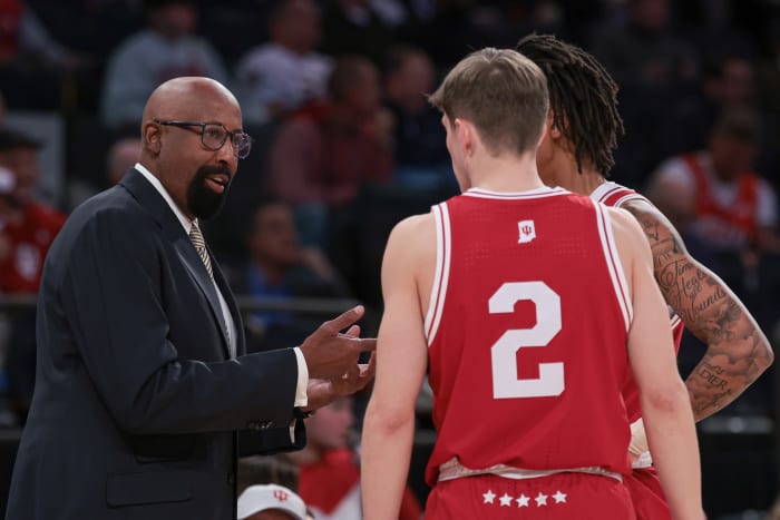 Indiana Hoosiers head coach Mike Woodson talks with guard Gabe Cupps (2) and guard CJ Gunn (11) during the first half against the Louisville Cardinals at Madison Square Garden.